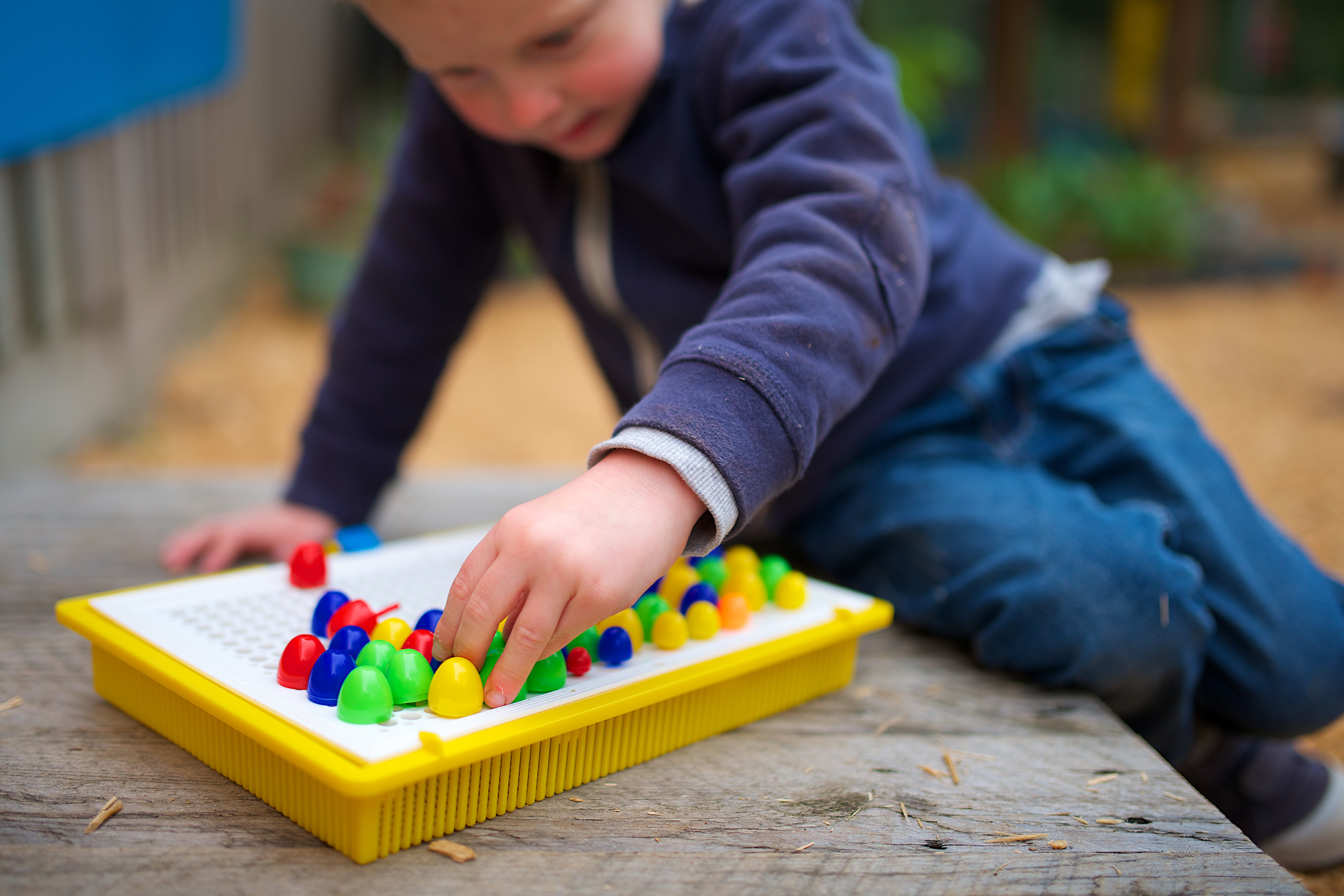 Child playing a board game very close up