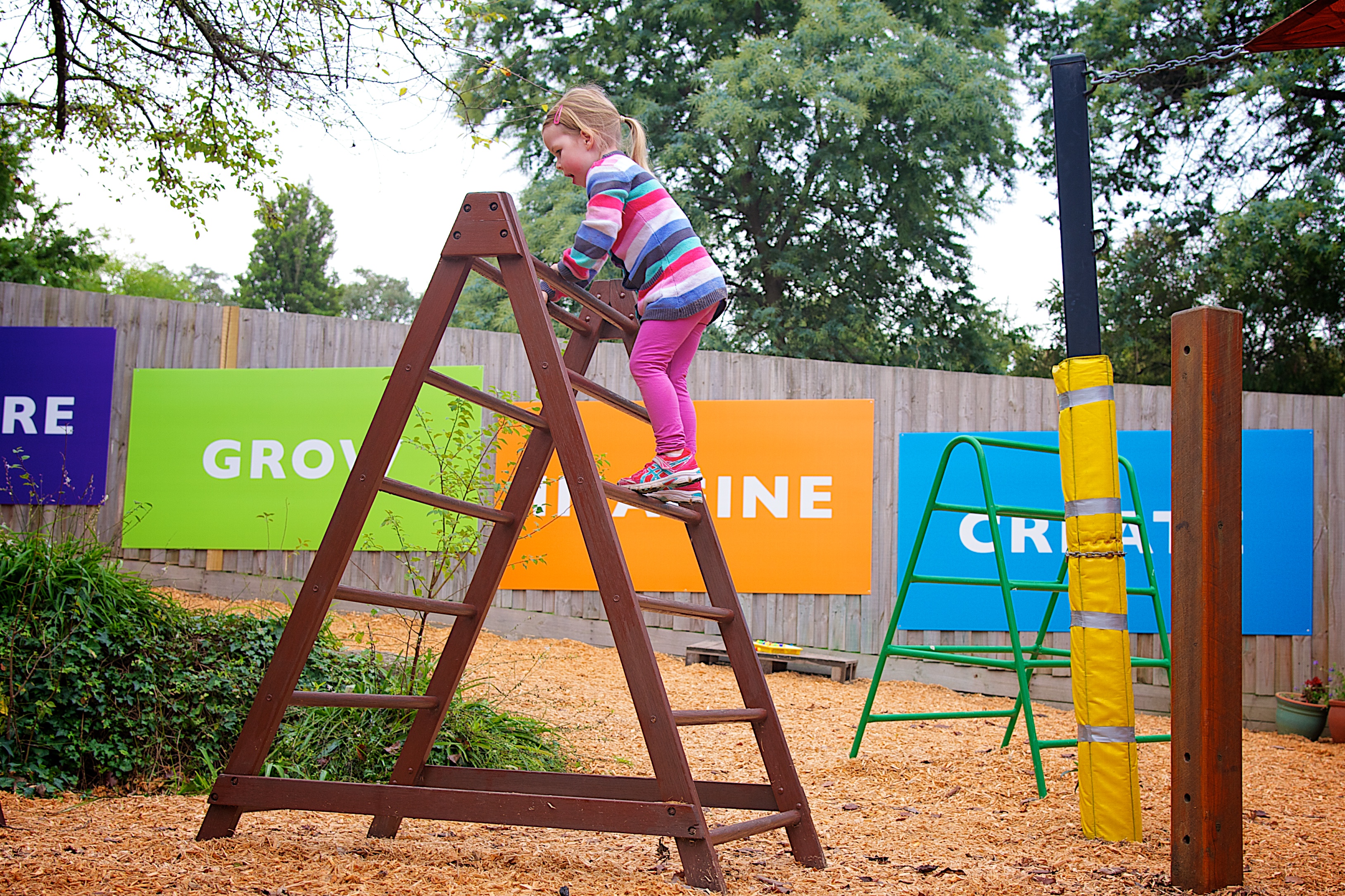 Child climbing A frame play equiptment